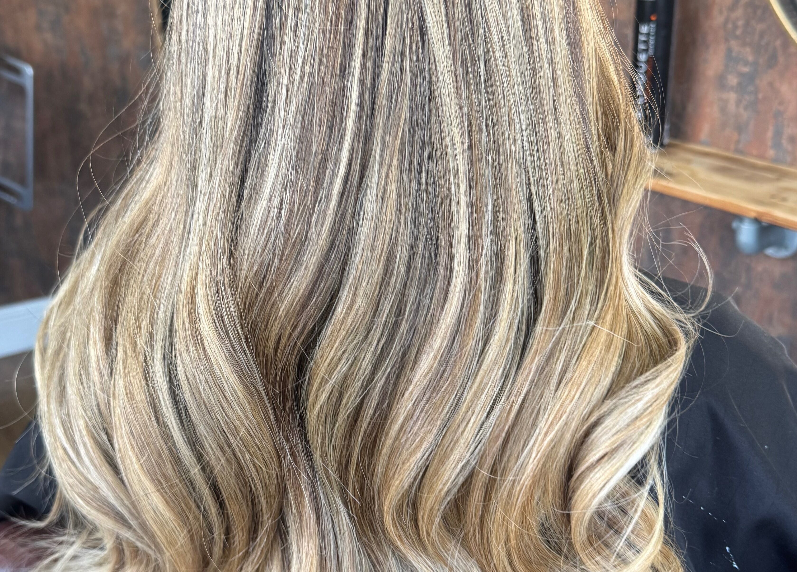 Blonde wavy hair styled at Hair by Demi at UNHIDDEN, Ossett, England, GB salon.