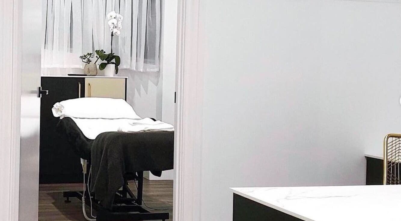 Modern Aesthetics treatment room in Woolooware, New South Wales, AU with a comfortable white massage bed.