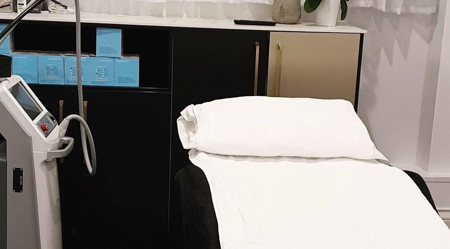 Modern Aesthetics treatment room with equipment in Woolooware, New South Wales, AU.