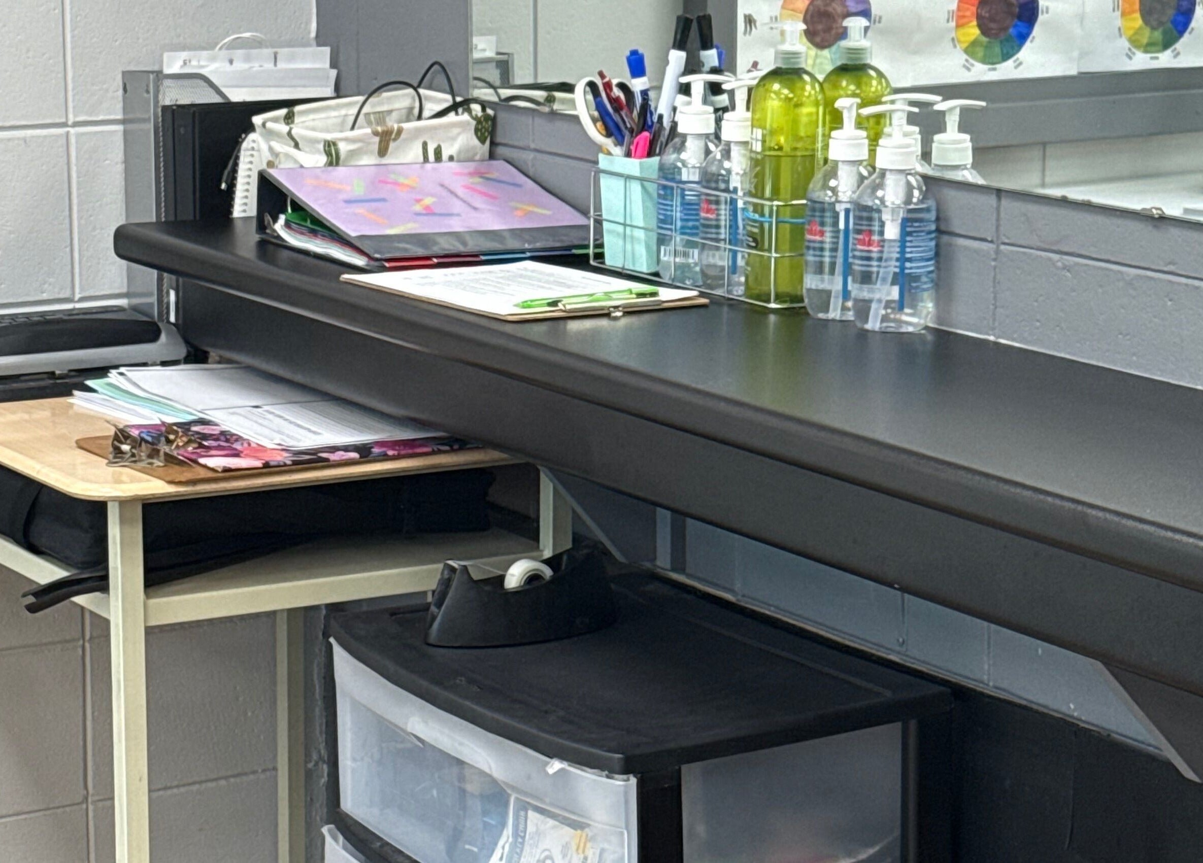 Neat workspace at Gatehouse Salon, Sault Ste Marie, Ontario, CA with salon supplies and a laptop.