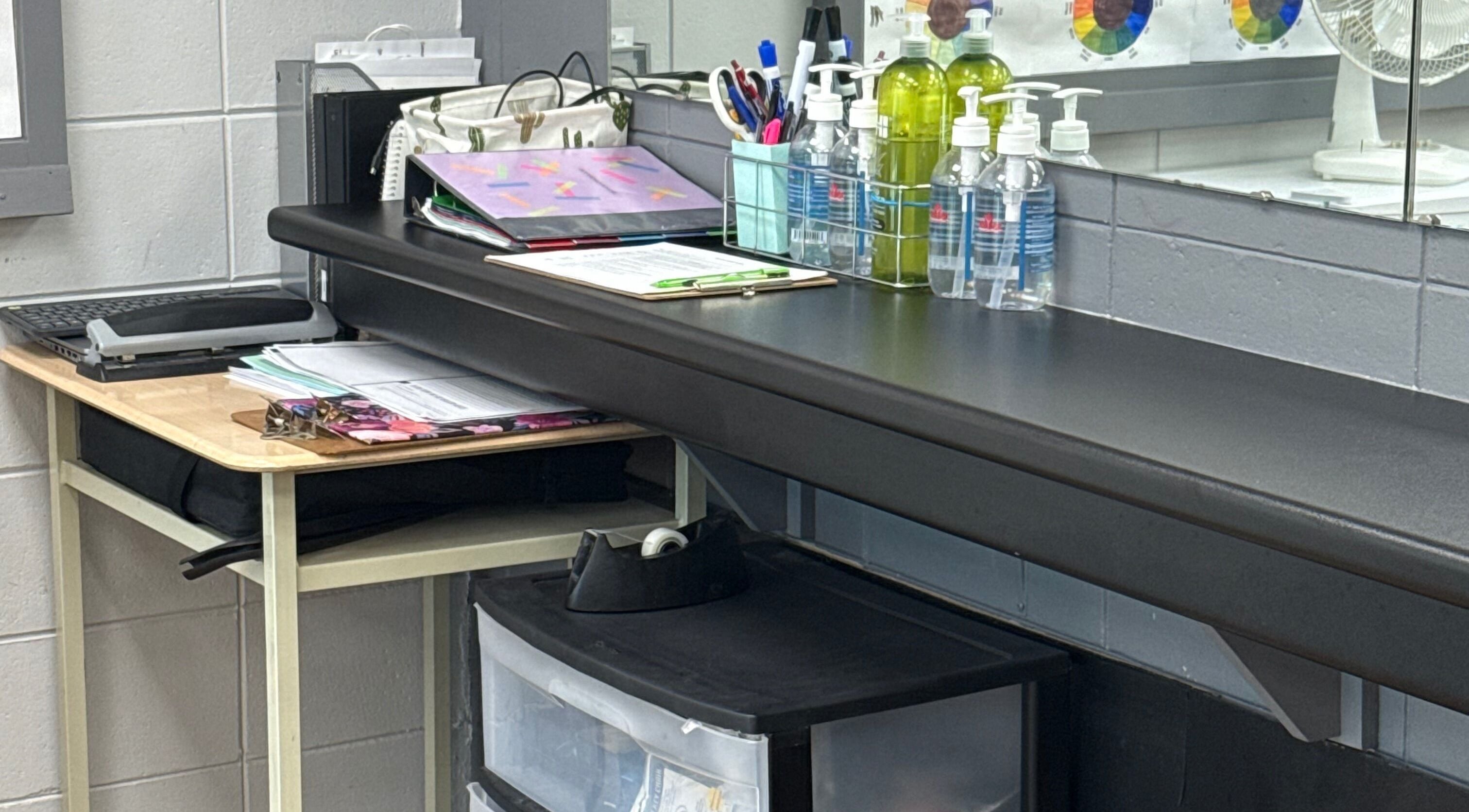 Neat workspace at Gatehouse Salon, Sault Ste Marie, Ontario, CA with salon supplies and a laptop.