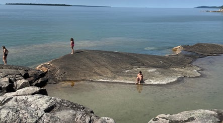 Visitors enjoying serene waters near Gatehouse Salon, Sault Ste Marie, Ontario, CA.