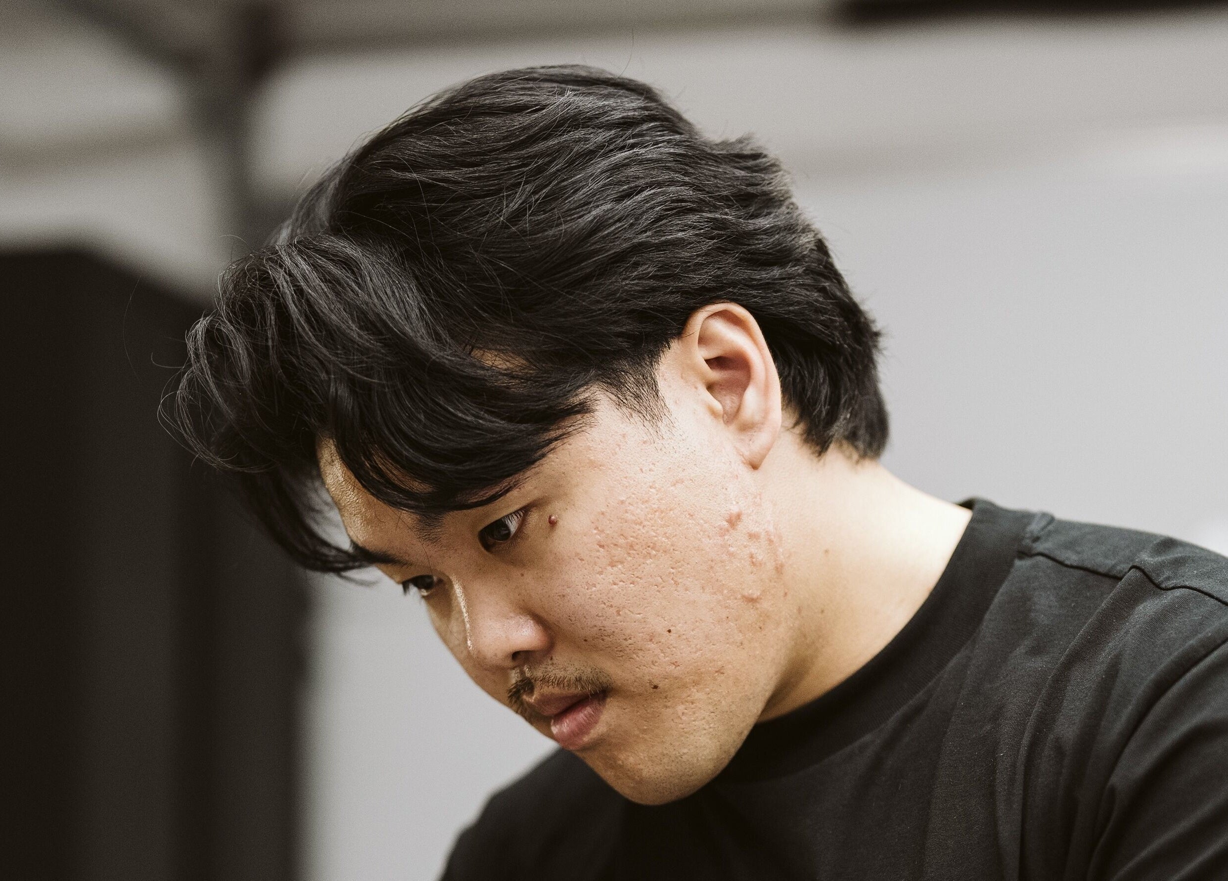 Barber at NewtsTheBarber x KapitalCuts focused in action, Perth, Western Australia, AU.