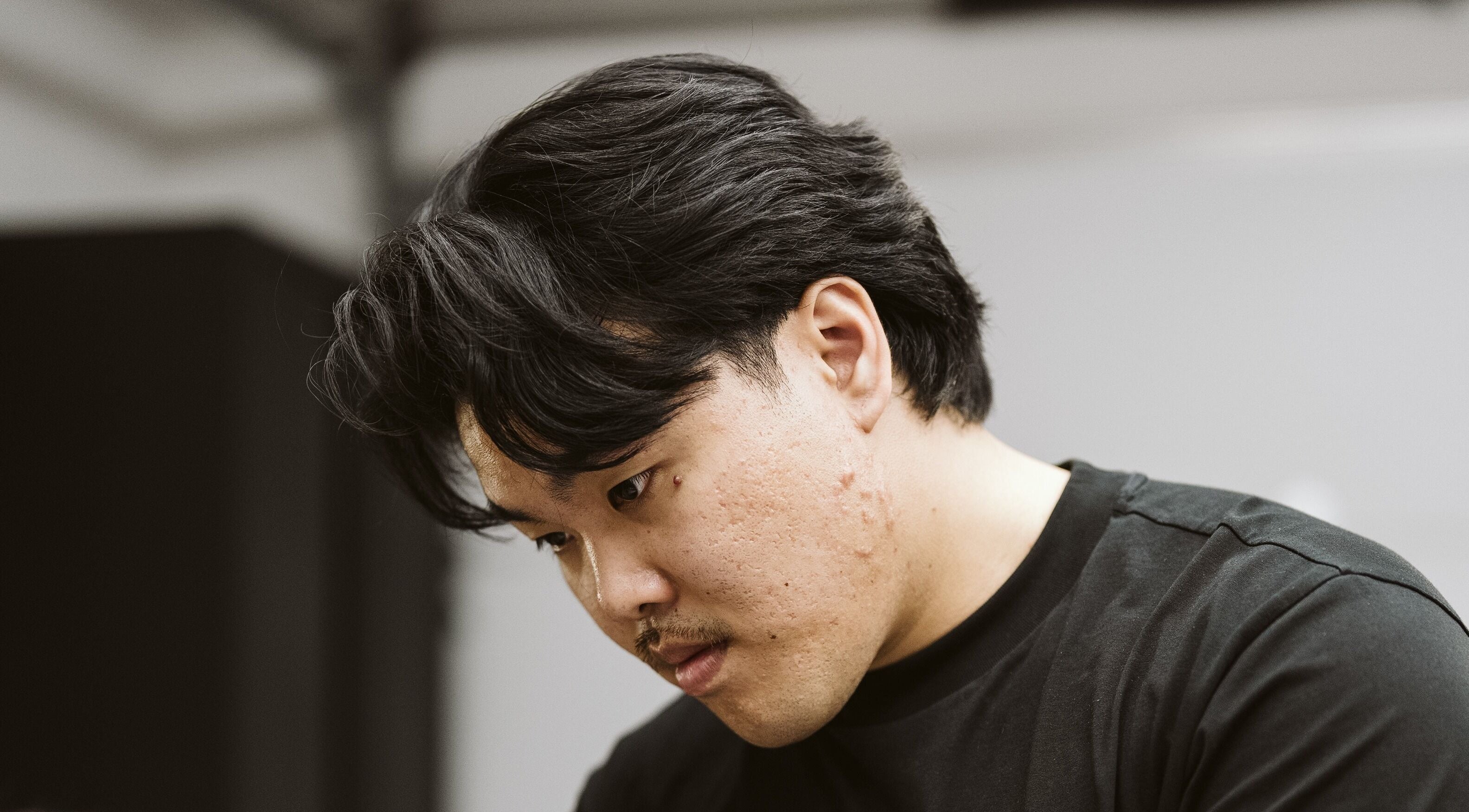 Barber at NewtsTheBarber x KapitalCuts focused in action, Perth, Western Australia, AU.