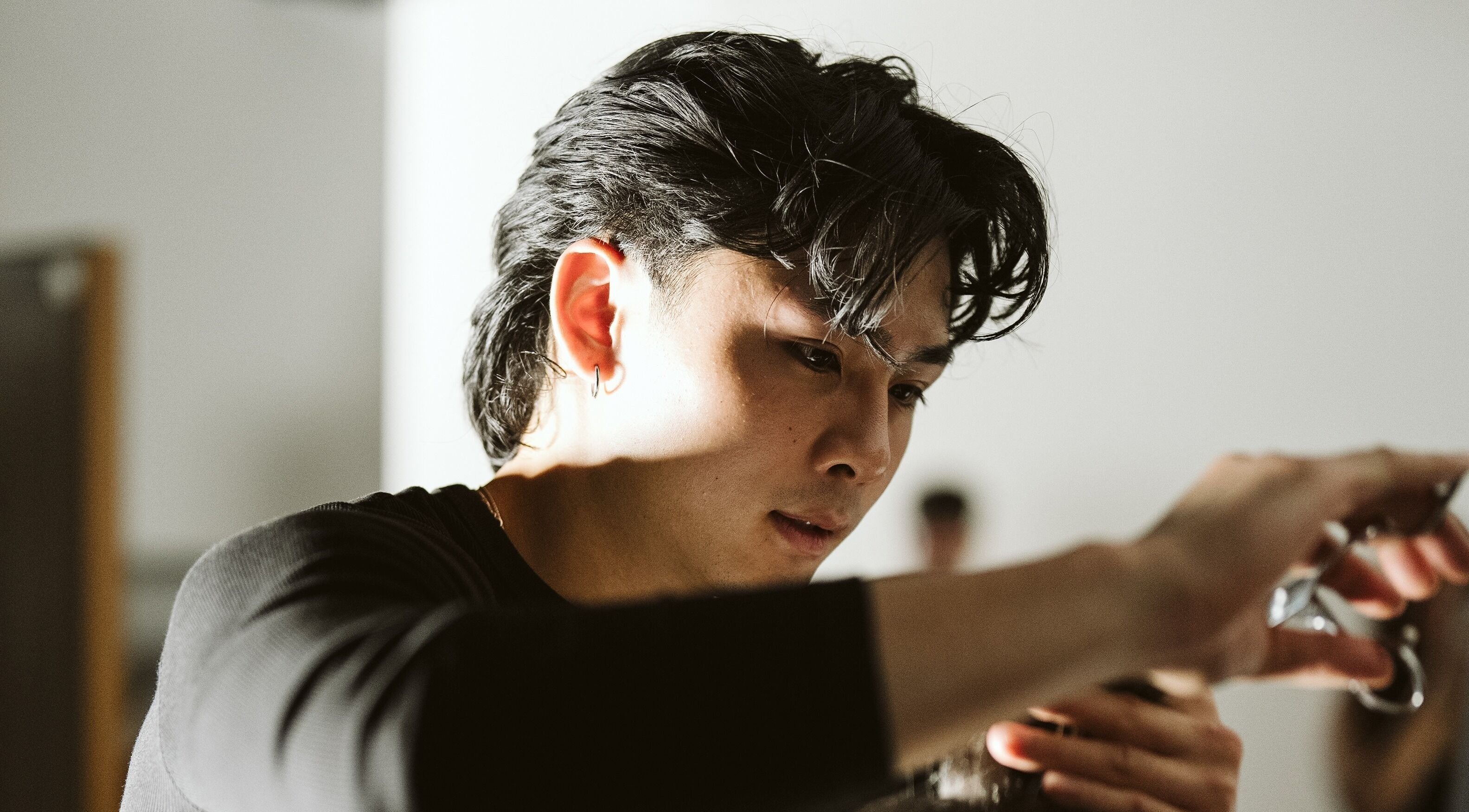 Expert barber crafting a haircut at NewtsTheBarber x KapitalCuts, Perth, Western Australia, AU.