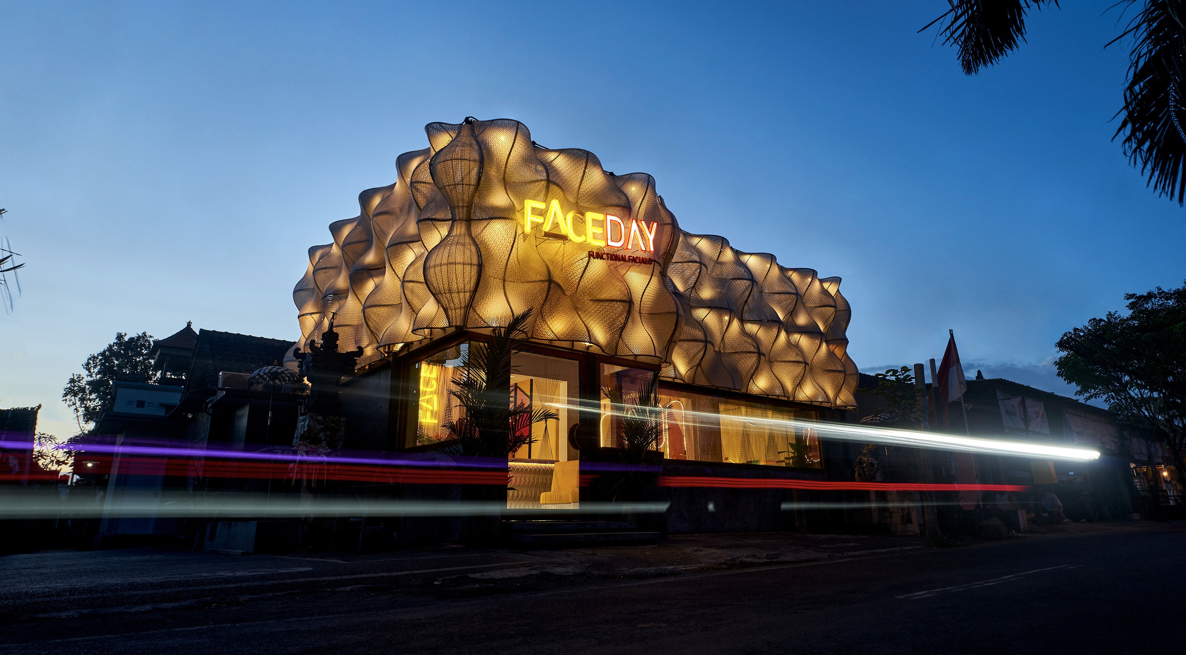 Stunning illuminated architecture of FaceDay in Bali, Bali, ID, glowing against the evening sky.