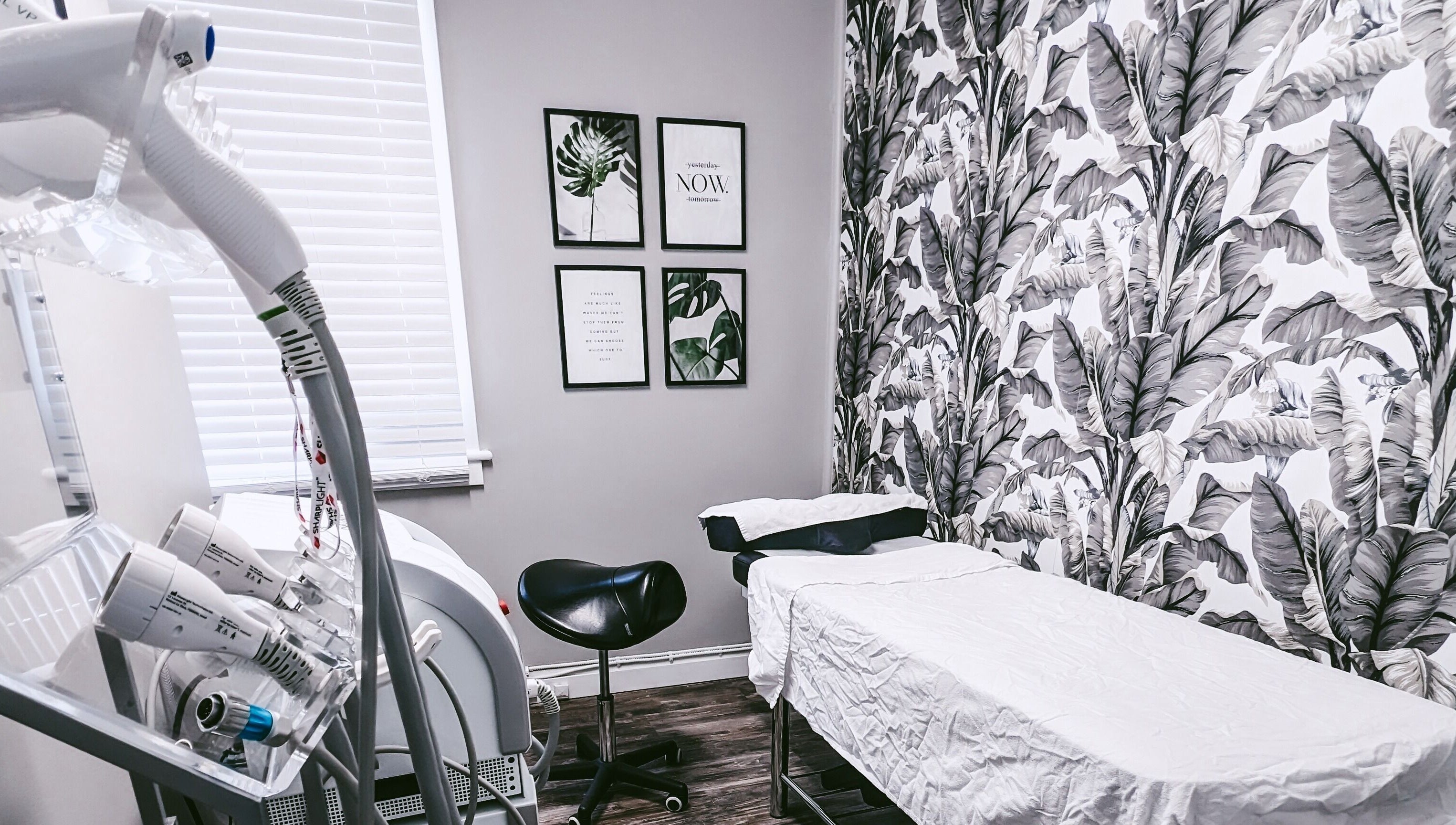 Modern treatment room at Beauty Box in Collingwood, Ontario, CA with tropical decor and advanced equipment.