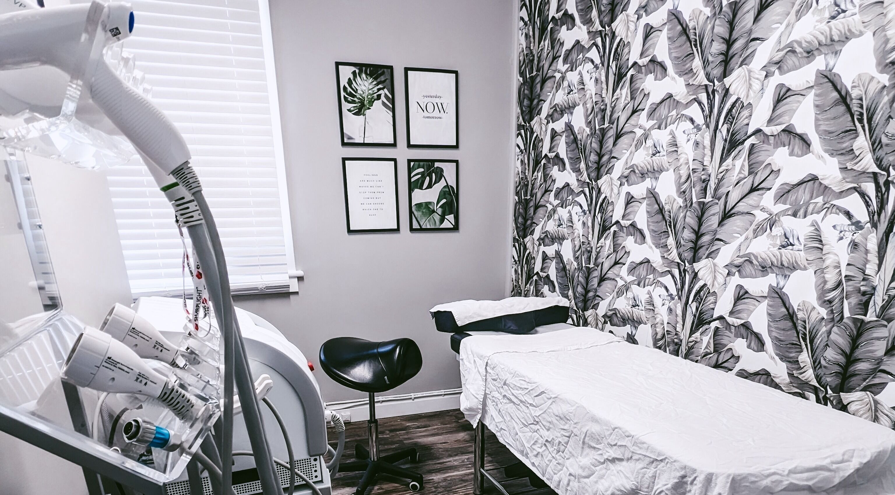 Modern treatment room at Beauty Box in Collingwood, Ontario, CA with tropical decor and advanced equipment.