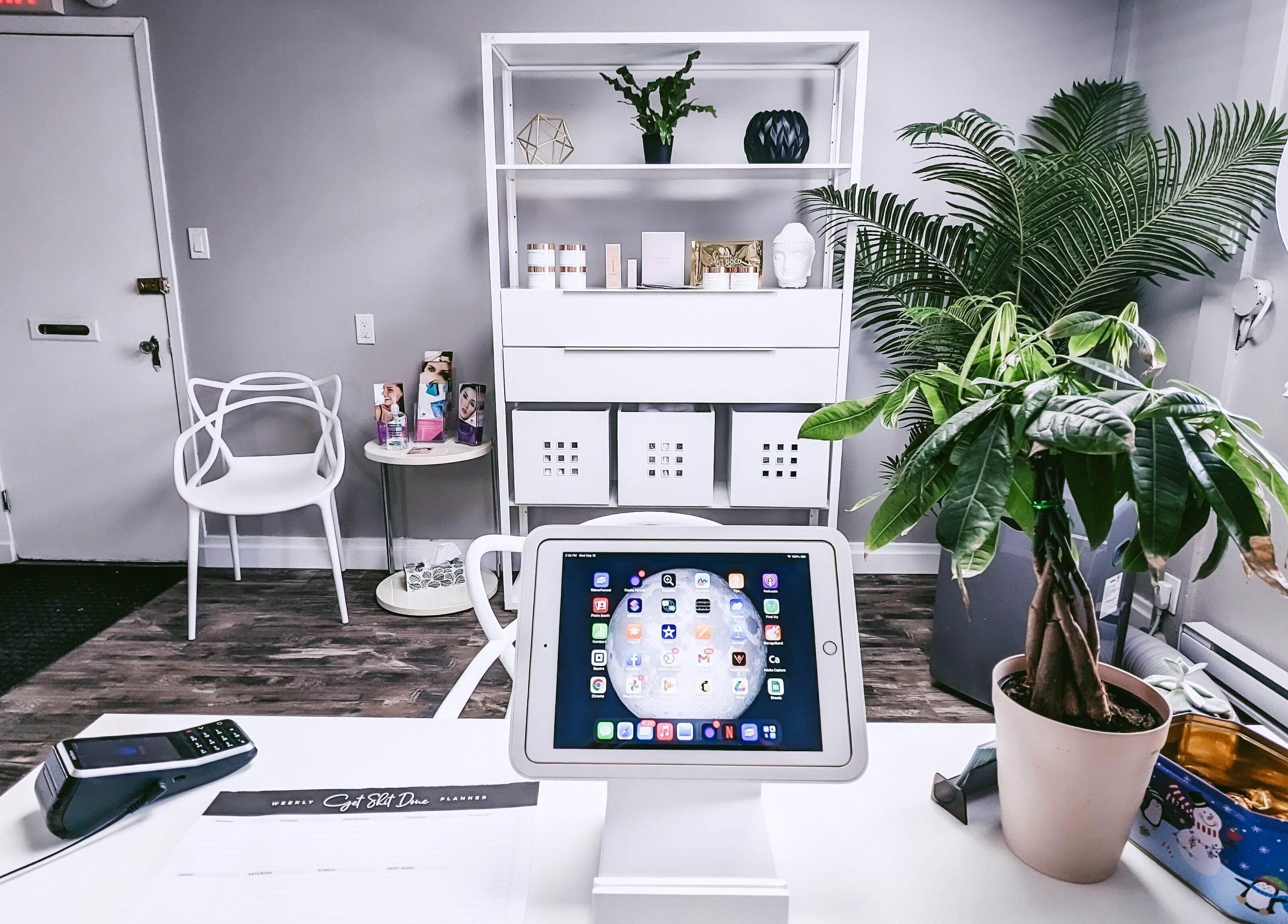 Calm beauty setting at Beauty Box, Collingwood, Ontario, CA, with white decor and indoor plants.