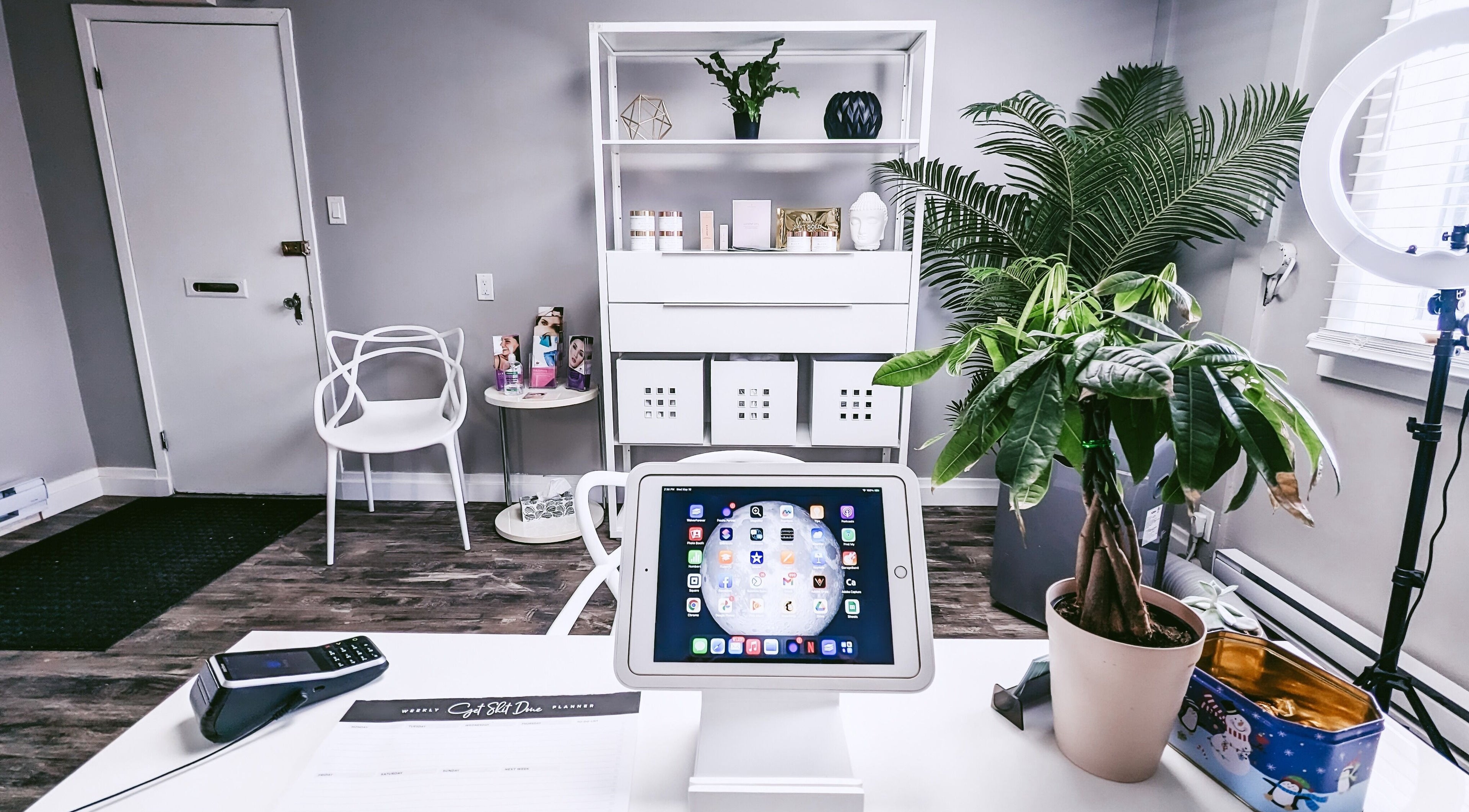 Calm beauty setting at Beauty Box, Collingwood, Ontario, CA, with white decor and indoor plants.