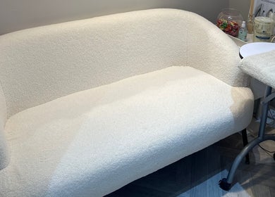 Elegant white seating area at Exclusive Beauty Spa in Sutton Coldfield, England, GB.