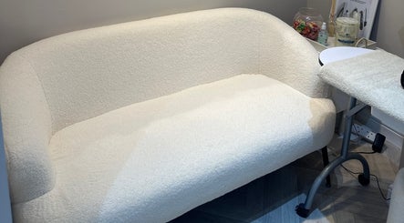 Elegant white seating area at Exclusive Beauty Spa in Sutton Coldfield, England, GB.