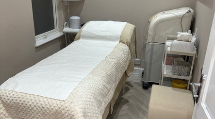Tranquil treatment room at Exclusive Beauty Spa, Sutton Coldfield, England, GB, featuring a comfortable spa bed.