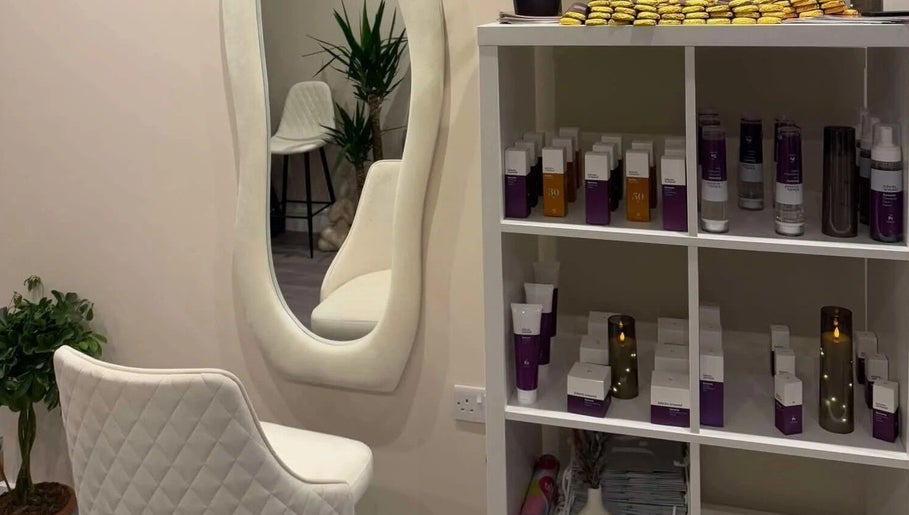 Elegant interior at Leyabelle Esthetic Clinic, Barking, England with products and stylish mirror setup.