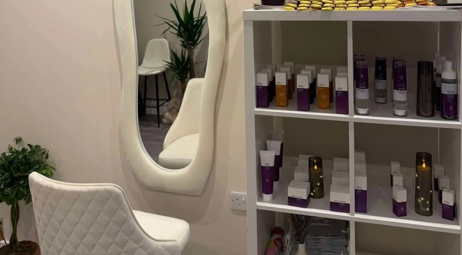 Elegant interior of Leyabelle Esthetic Clinic in Barking, England, showcasing beauty products and chic furnishings.
