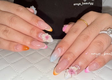 Elegant floral nail design at Halo by Amy, Newport Pagnell, England, GB showcasing detailed craftsmanship.