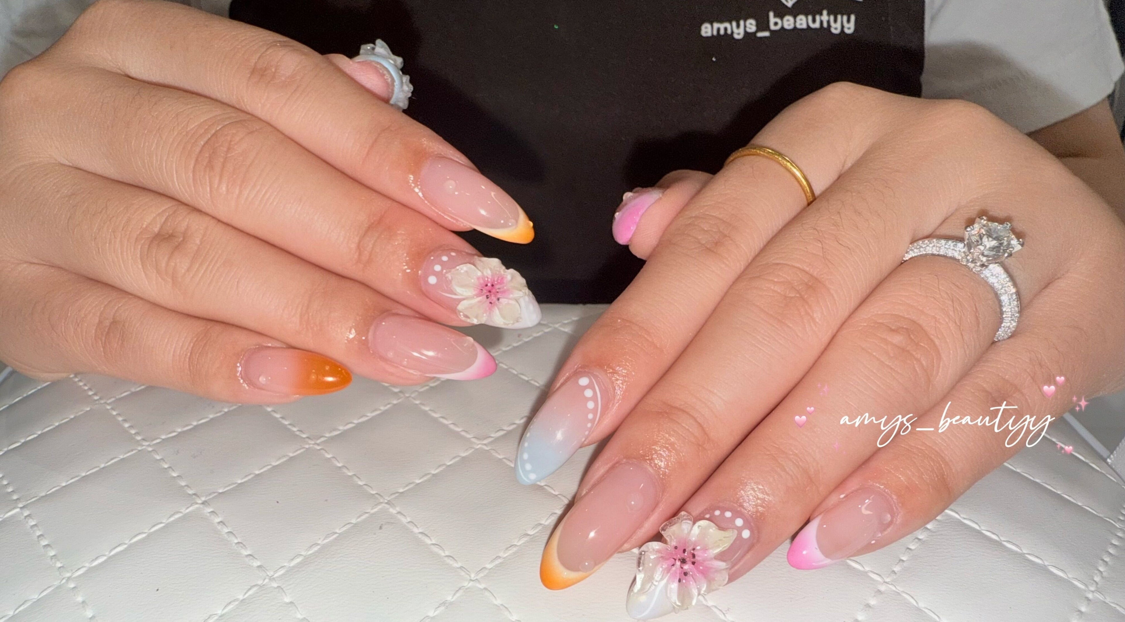 Elegant floral nail design at Halo by Amy, Newport Pagnell, England, GB showcasing detailed craftsmanship.