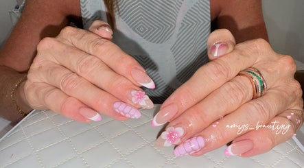 Beautiful floral nail art at Halo by Amy, Newport Pagnell, England, GB. Elegant pink and white design.