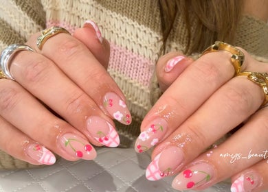 Elegant cherry blossom nail art at Halo by Amy, Newport Pagnell, England, GB, showcasing floral creativity.