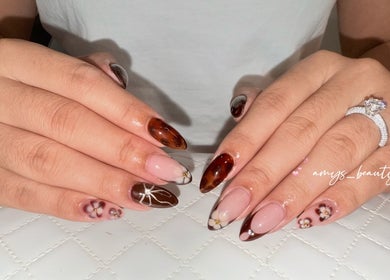 Beautiful nail art with floral and marble design at Halo by Amy, Newport Pagnell, England, GB.