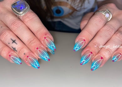 Vibrant nail art design at Halo by Amy, Newport Pagnell, England, GB, showcasing blue and pink geometric patterns.