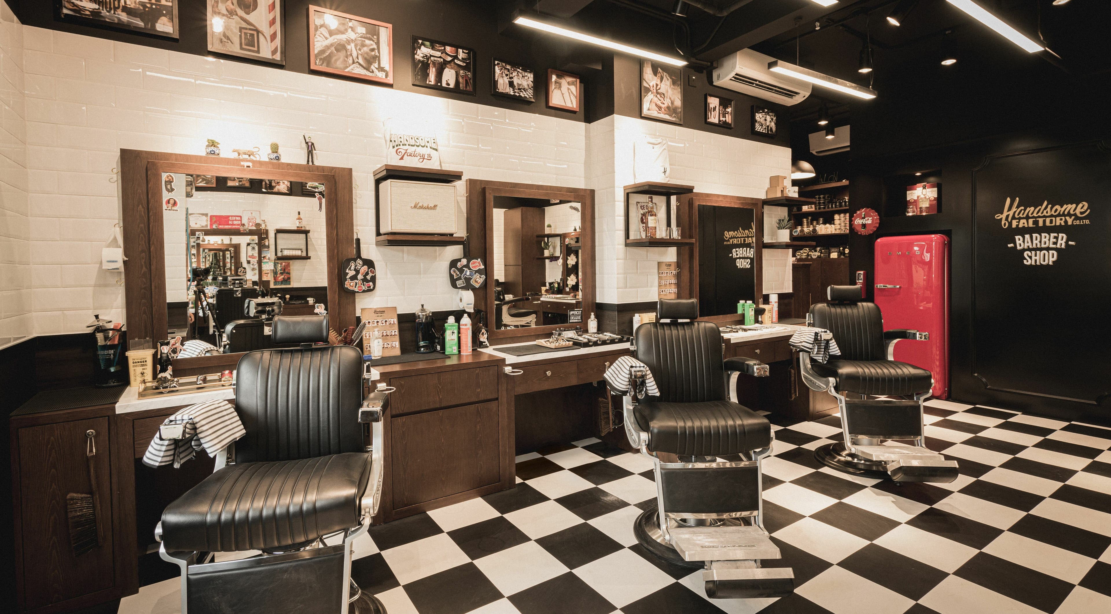 Interior of Causeway Bay 2 Handsome Factory Barber Shop, Hong Kong Island, featuring classic barber chairs and decor.