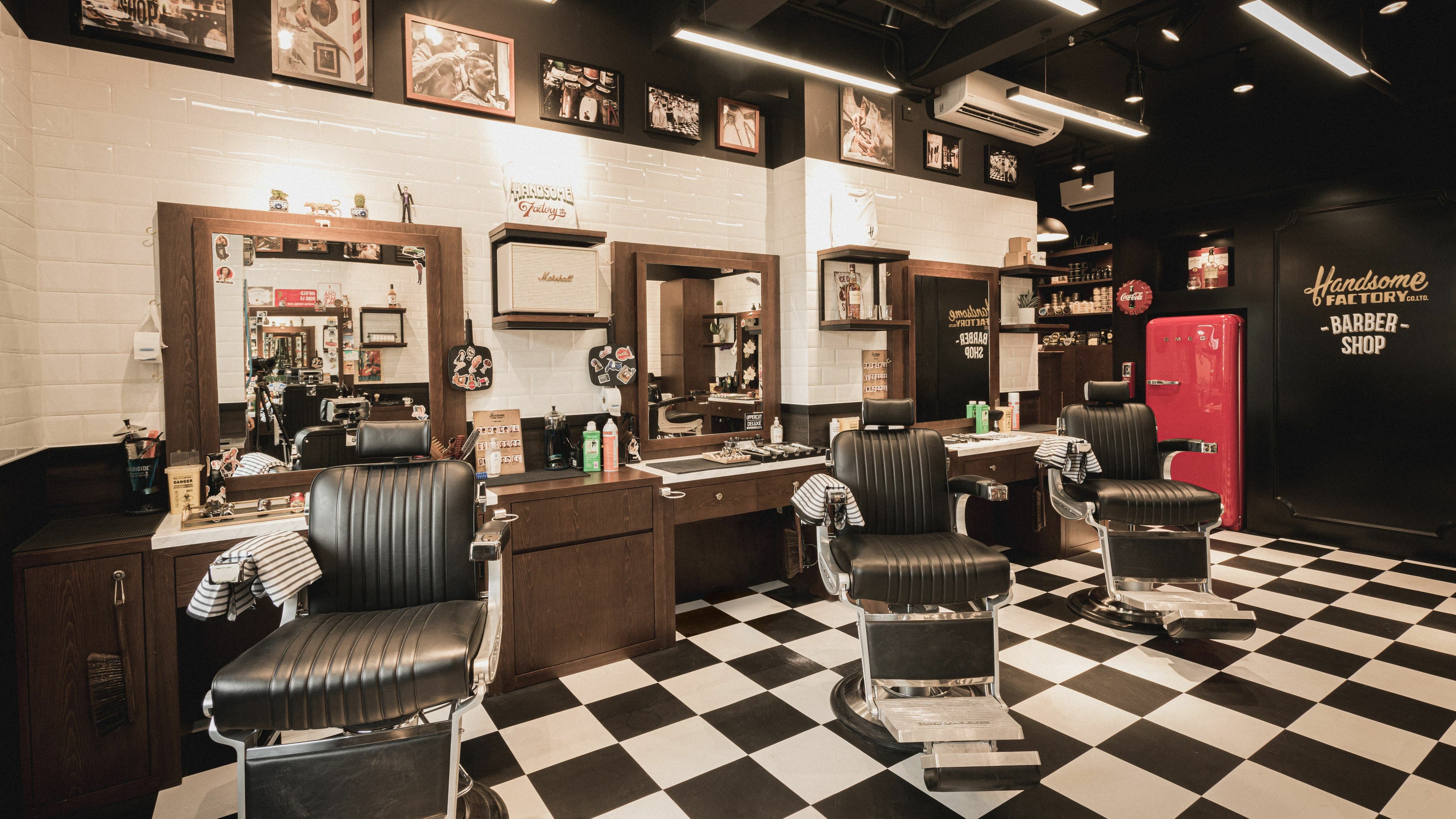 Interior of Causeway Bay 2 Handsome Factory Barber Shop, Hong Kong Island, featuring classic barber chairs and decor.
