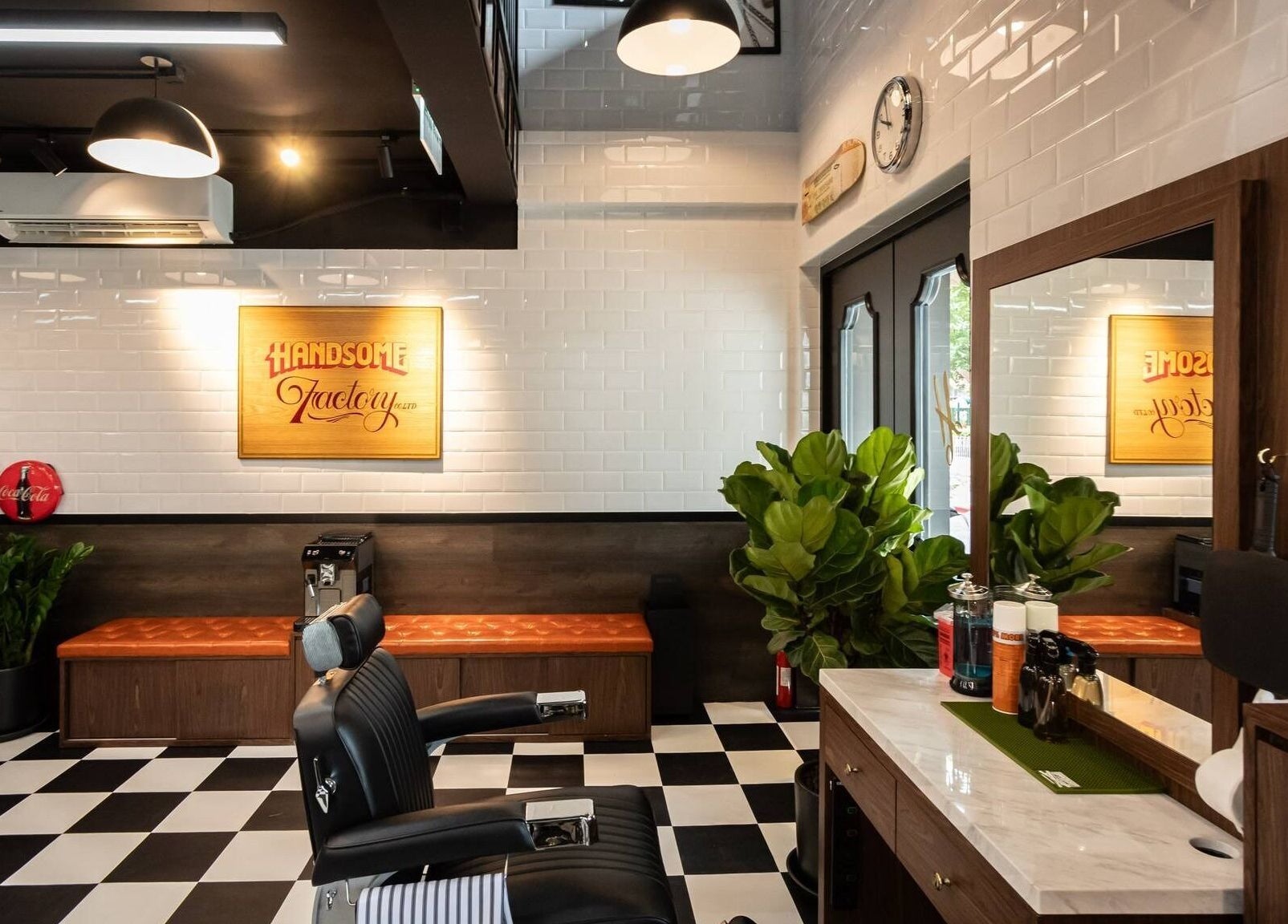 Interior of Tsim Sha Tsui | Handsome Factory Barber Shop in Kowloon, Kowloon, HK. Sleek design and modern seating.