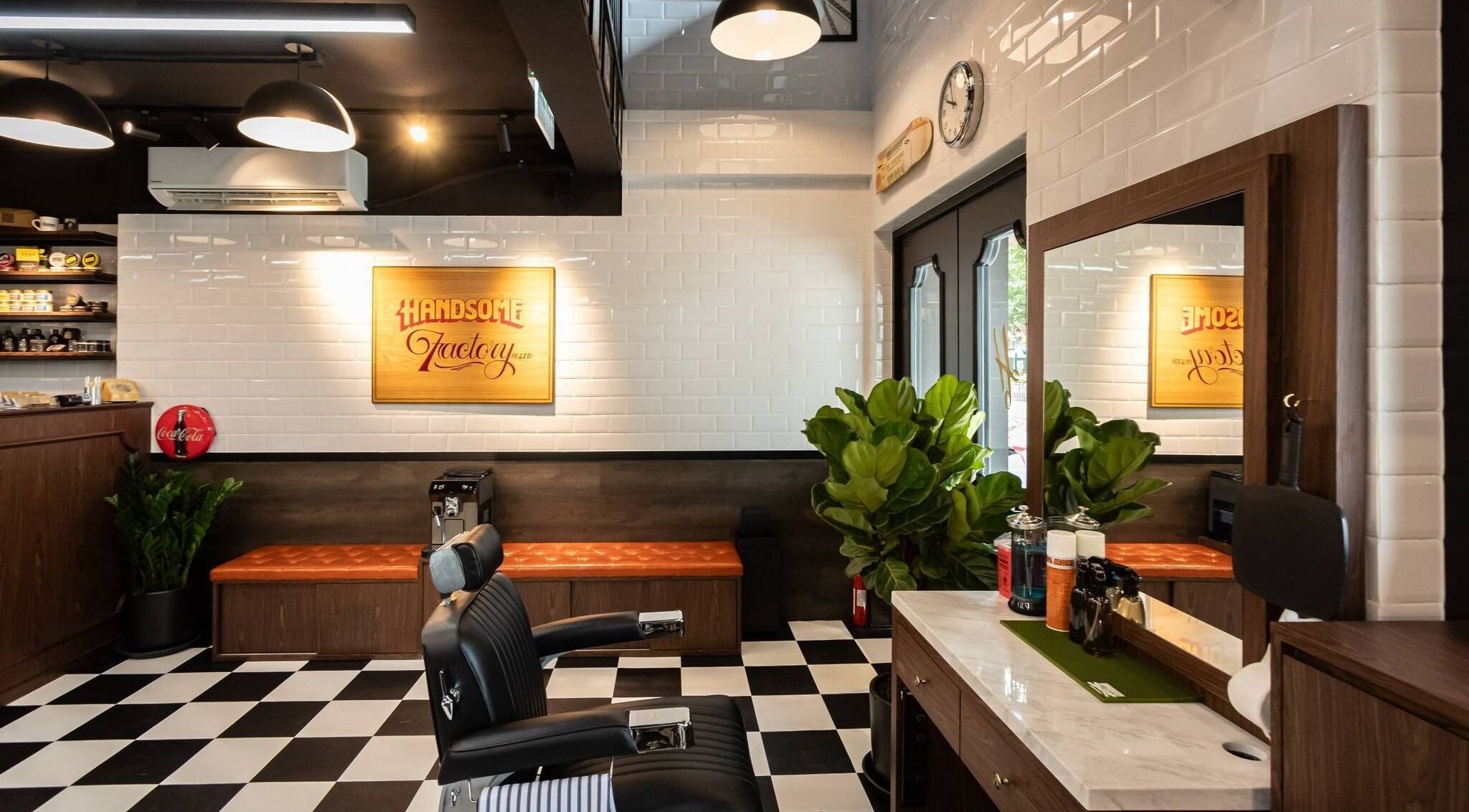 Interior of Tsim Sha Tsui | Handsome Factory Barber Shop in Kowloon, Kowloon, HK. Sleek design and modern seating.