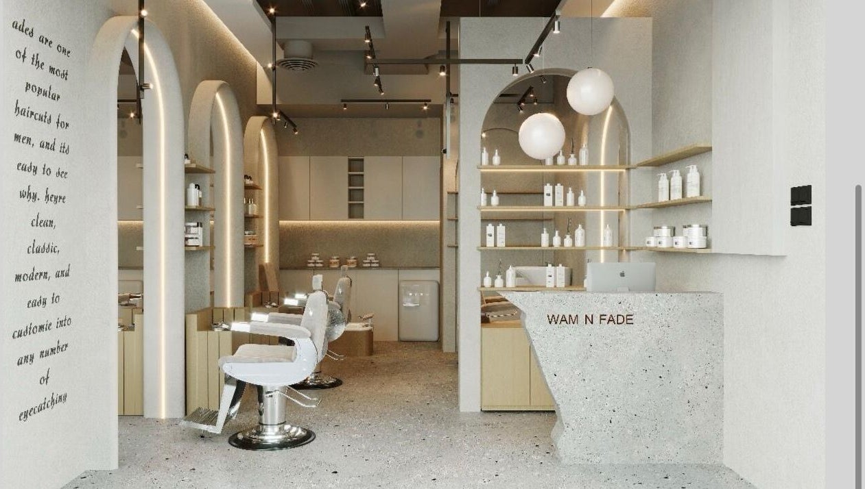 Modern interior of Wam N Fade salon in Dubai featuring stylish chairs and sleek design.