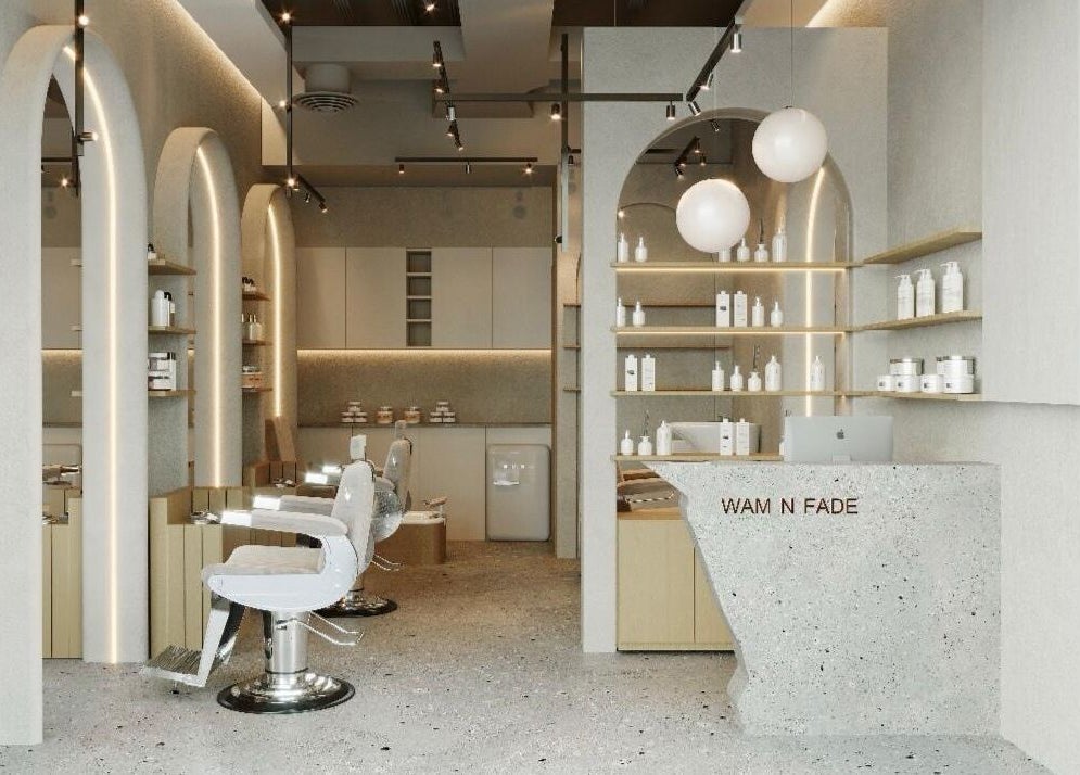 Modern interior of Wam N Fade salon in Dubai featuring stylish chairs and sleek design.