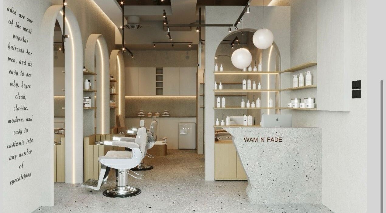 Modern interior of Wam N Fade salon in Dubai featuring stylish chairs and sleek design.