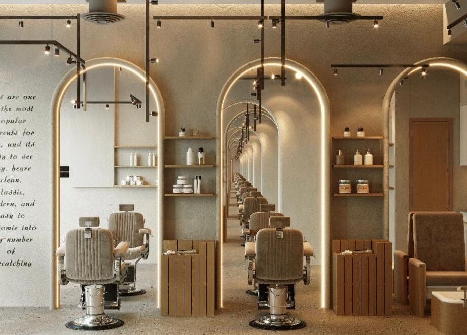 Modern interior of Wam N Fade salon in Dubai, Dubai, AE with stylish chairs and lighting.