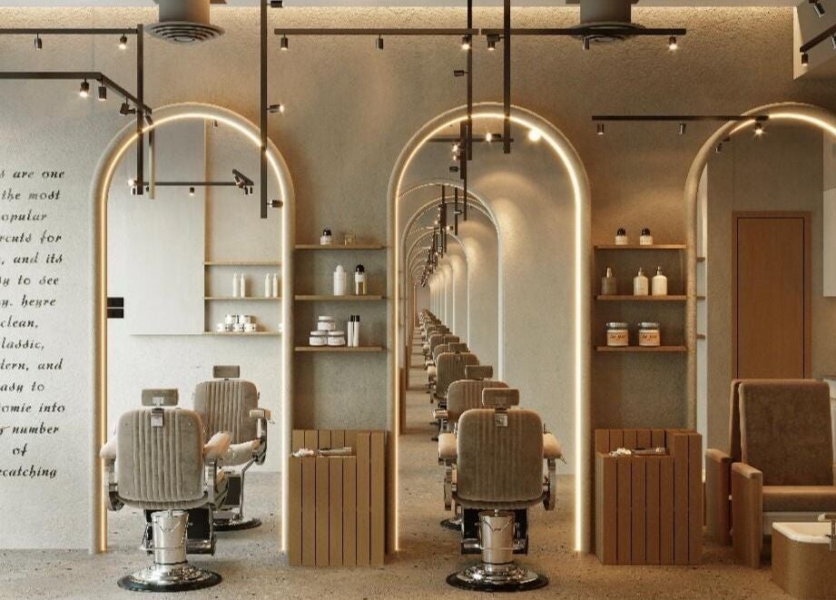 Modern interior of Wam N Fade salon in Dubai, Dubai, AE with stylish chairs and lighting.