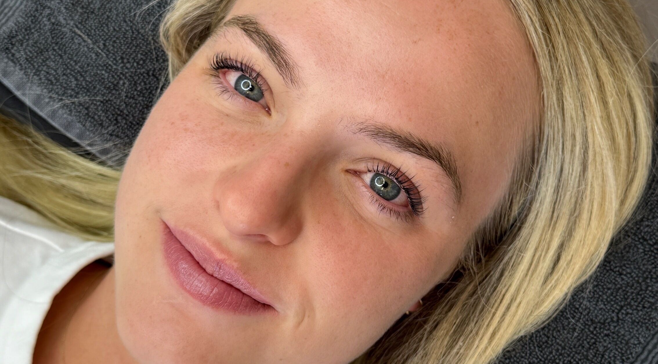 Close-up of a woman's face with natural makeup at The Self Love Lab, Alfredton, Victoria, AU.