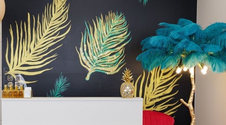 Stylish interior at Haircare Pro Salon Academy Shop Qew | Cawthra, Mississauga, Ontario, CA with tropical decor.