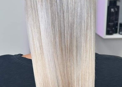 Smooth, straight blonde hair styled at Haircare Pro Salon Academy Shop Qew | Cawthra, Mississauga, Ontario, CA.