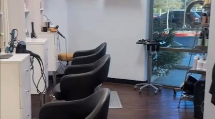 Modern interior of The Curl Studio, Las Vegas, Nevada, US with stylish styling chairs and sleek design.