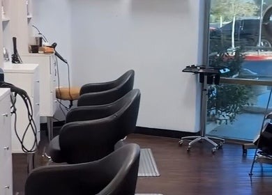 Modern salon chairs at Curl & Color Studio in Las Vegas, Nevada, US, emphasizing comfort and style.
