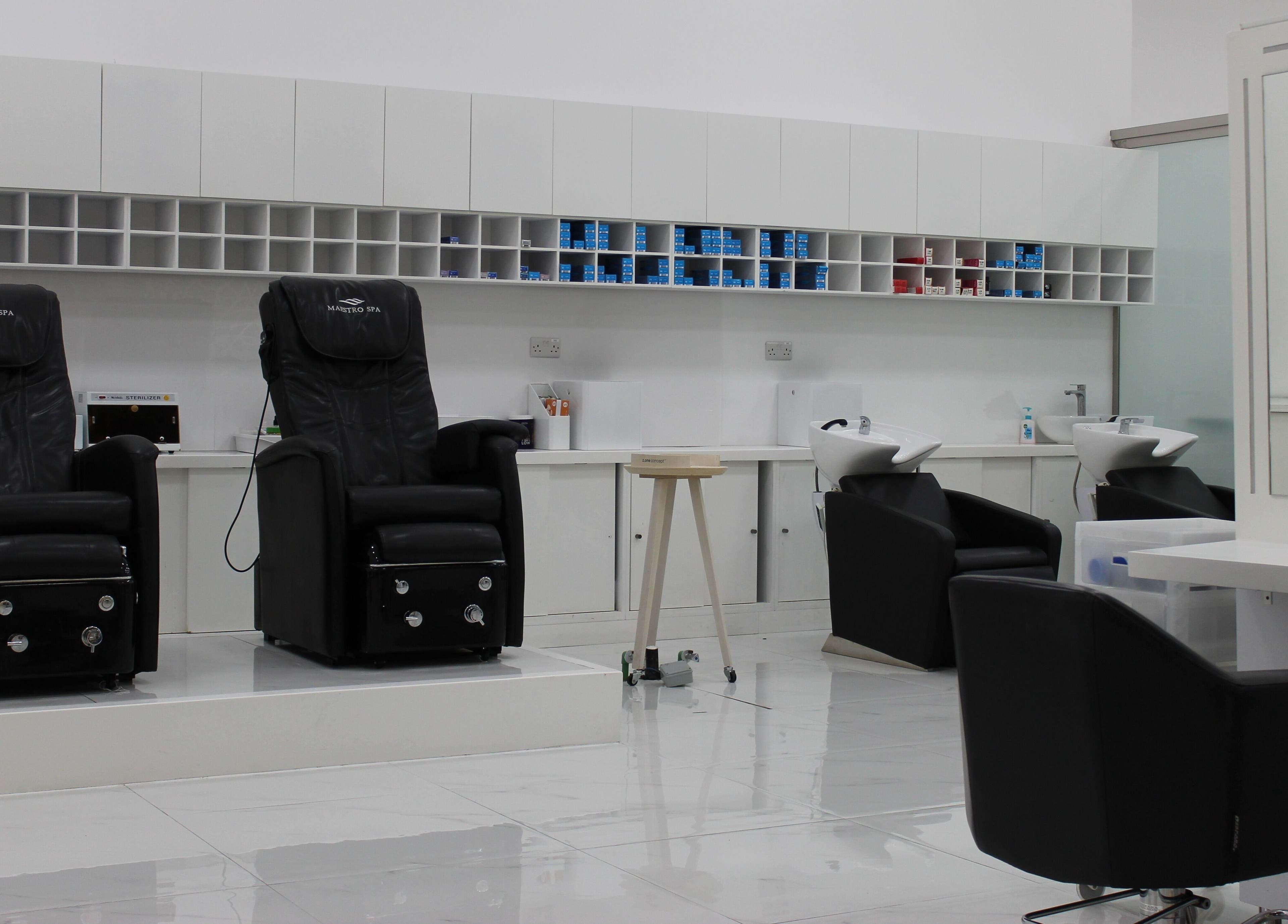 Modern salon interior with luxury chairs at Hair Creators Gate Avenue, Dubai, Dubai, AE.