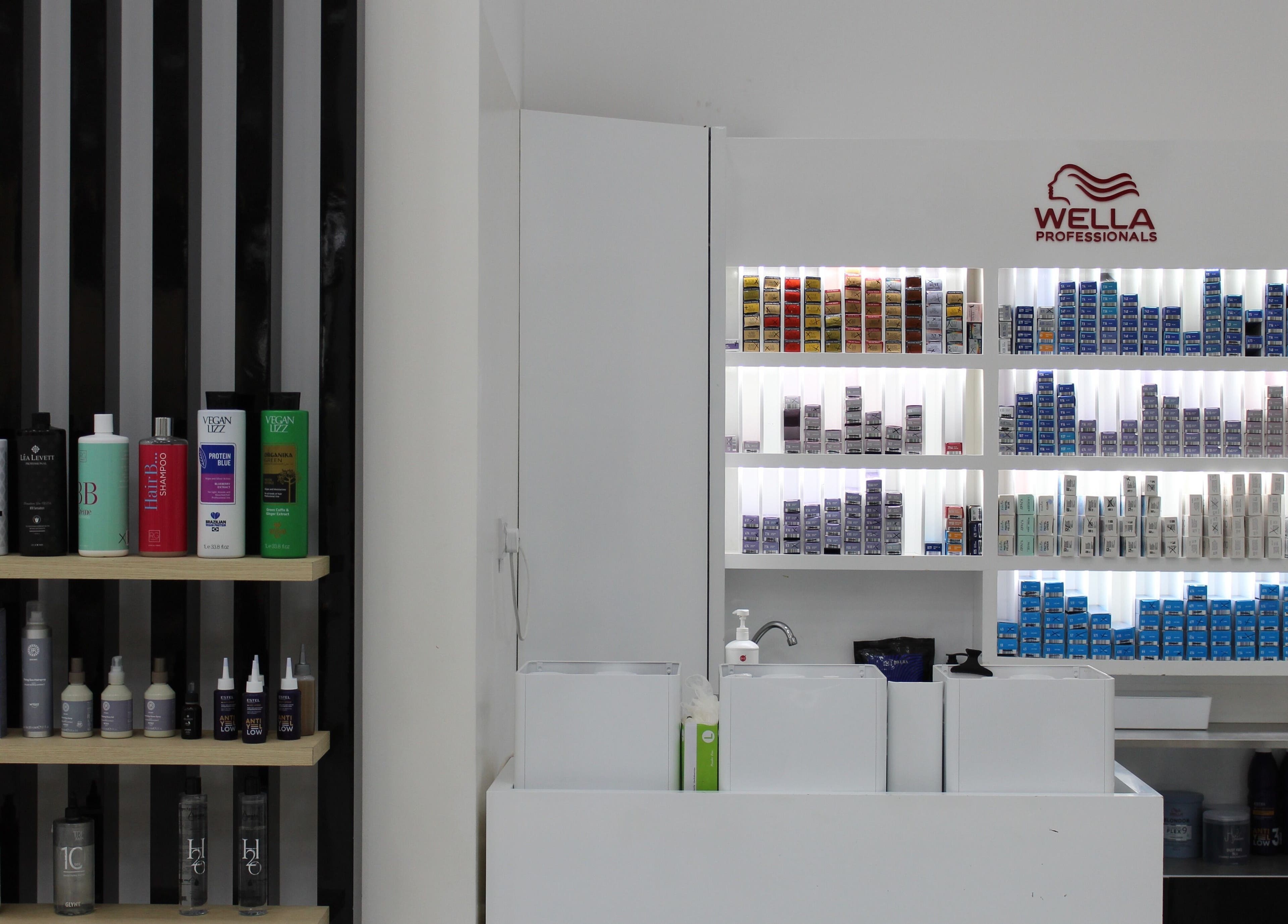 Organized shelves with hair care products at Hair Creators Gate Avenue, Dubai, Dubai, AE.