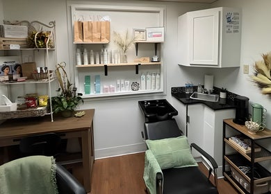 Cozy salon setup at Uninhibited Curls by Lori Peppin Hair in Lubbock, Texas, US with stylish decor and hair products.