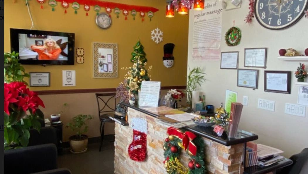 AJ Reflexology's warmly decorated reception area with holiday decor in Gilbert, Arizona, US.