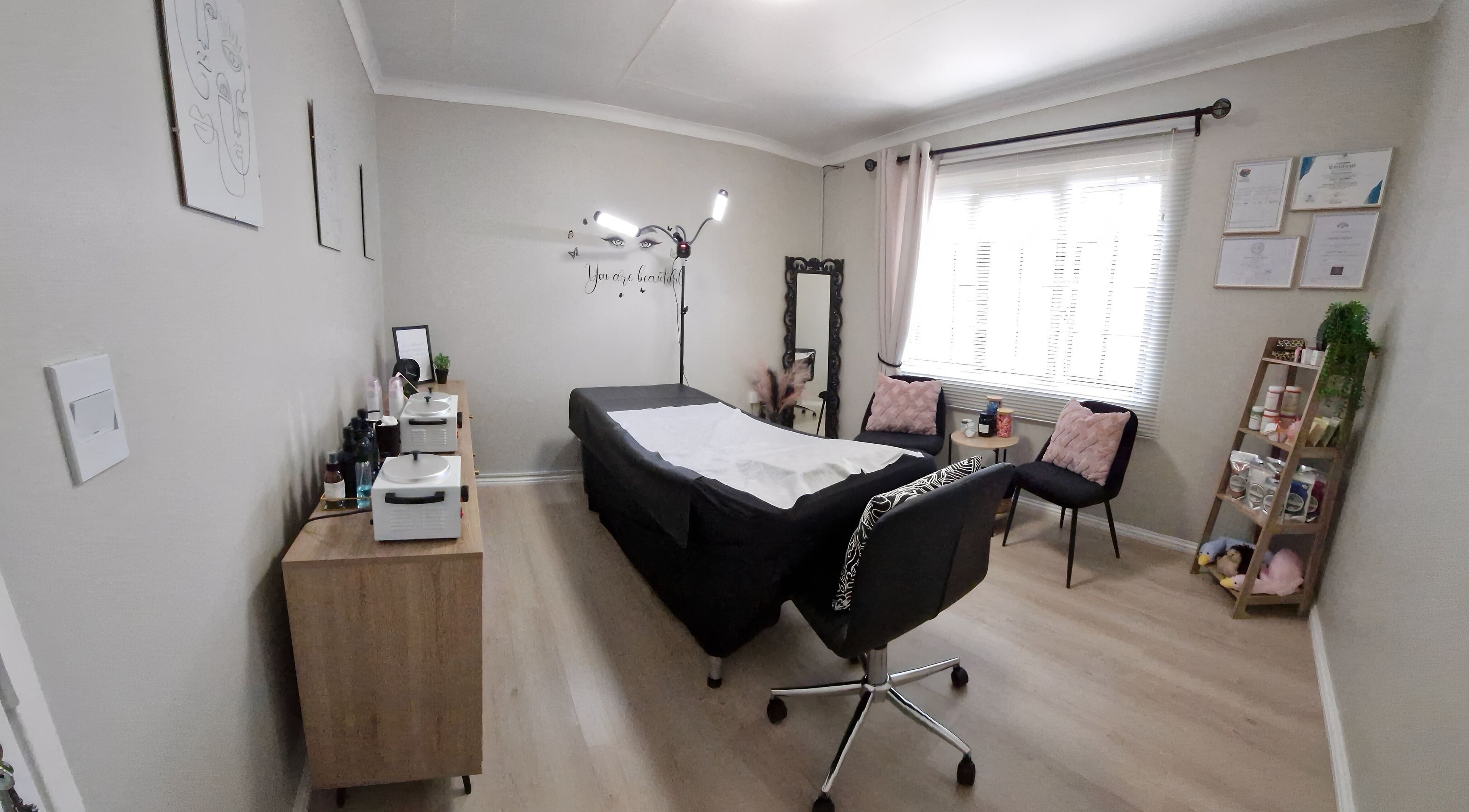 Relaxing interior at Cherish Your Beauty: Wax & Brow Studio, Edenvale, Gauteng, ZA with a treatment bed and decor.