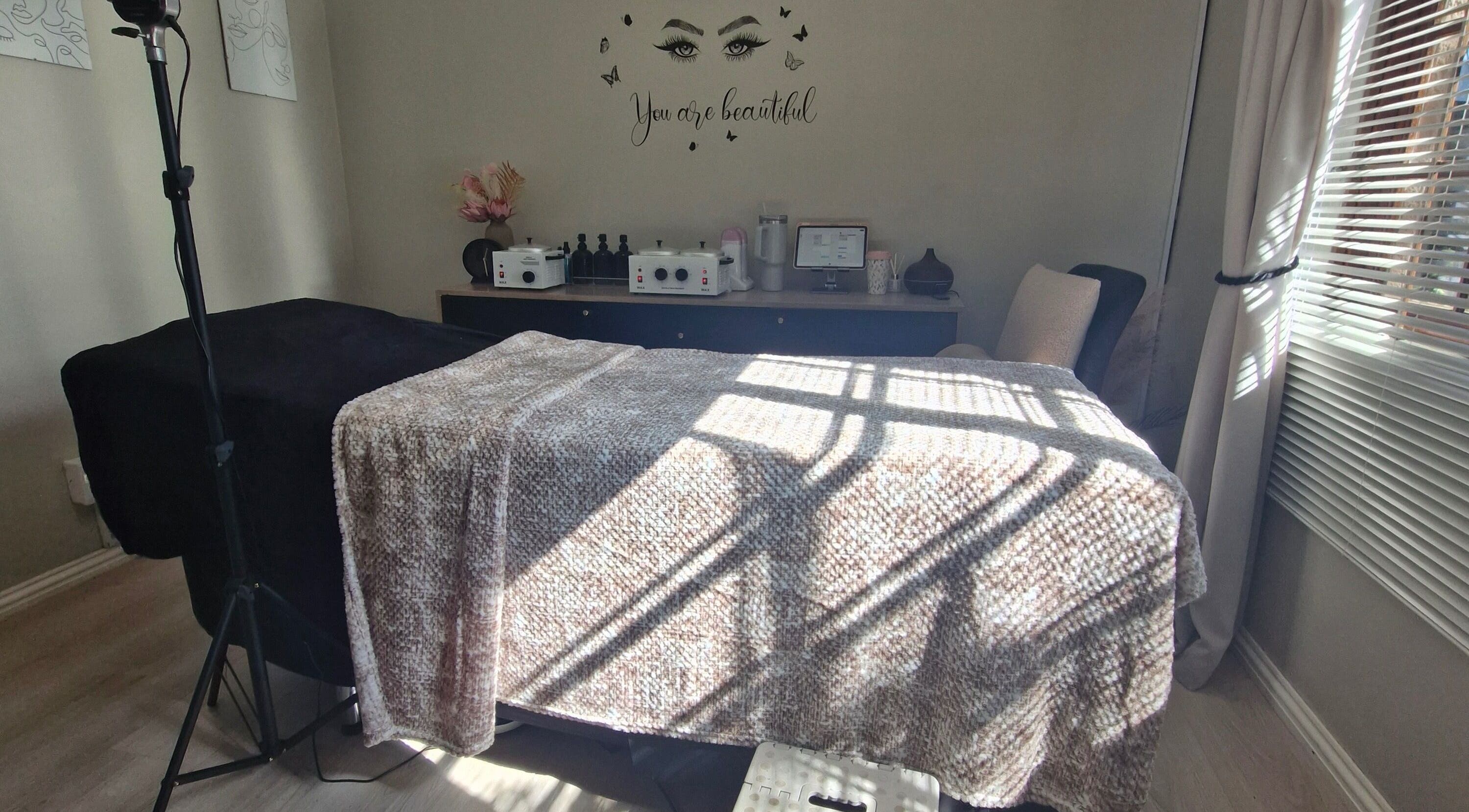 Treatment room at Cherish Your Beauty: Wax & Brow Studio, Edenvale, Gauteng, ZA with cozy decor and natural light.