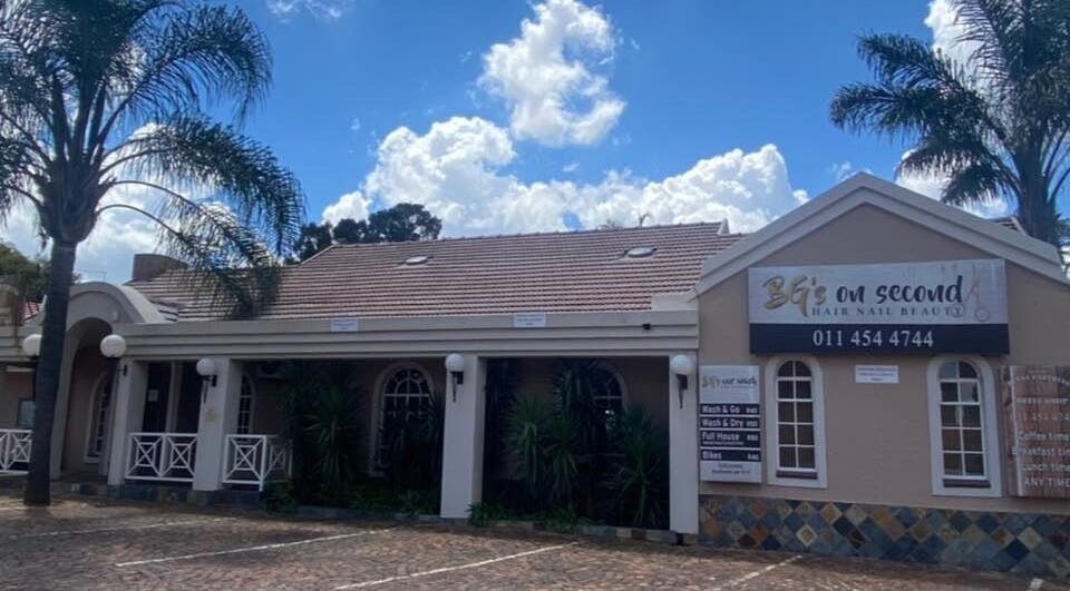 Exterior of Cherish Your Beauty: Wax & Brow Studio, Edenvale, Gauteng, ZA under a clear blue sky.