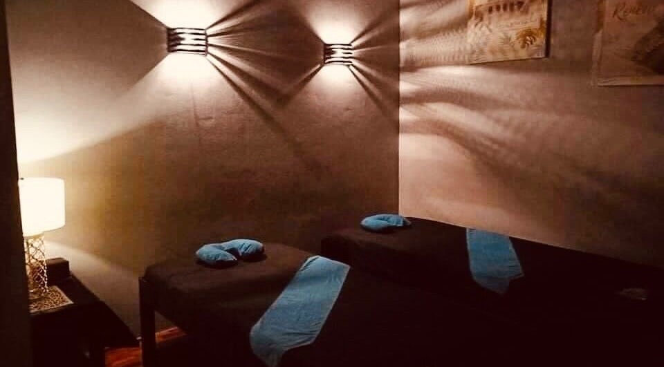 Relaxing massage room with two beds at Naya Boutique Spa, Quezon City, Metro Manila, PH.