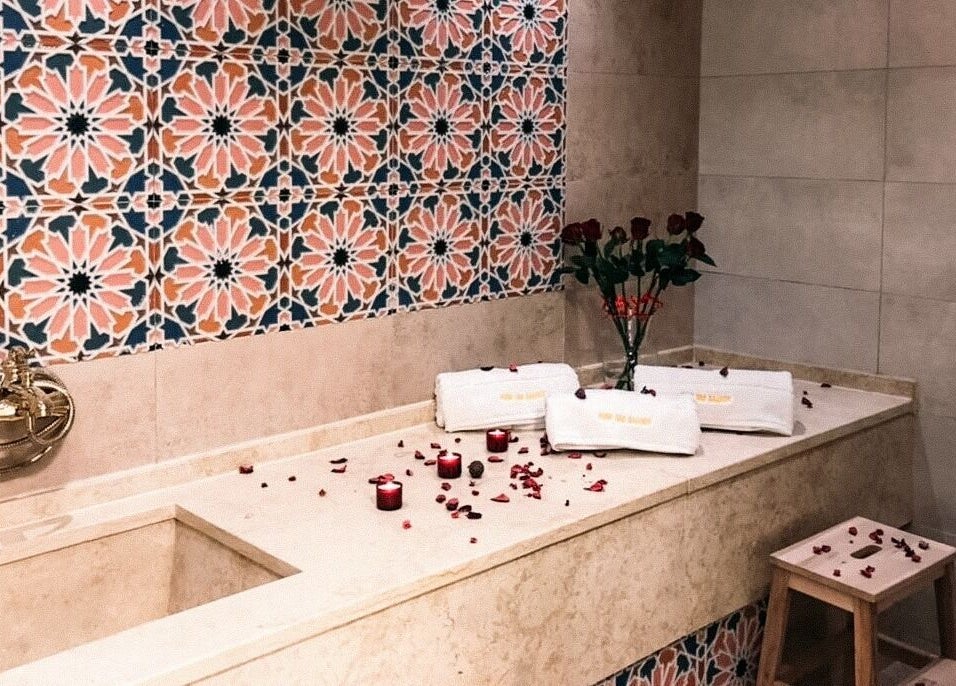Luxurious bath setup at New Tec Saloon, Dubai, Dubai, AE featuring elegant tiles and pampering amenities.