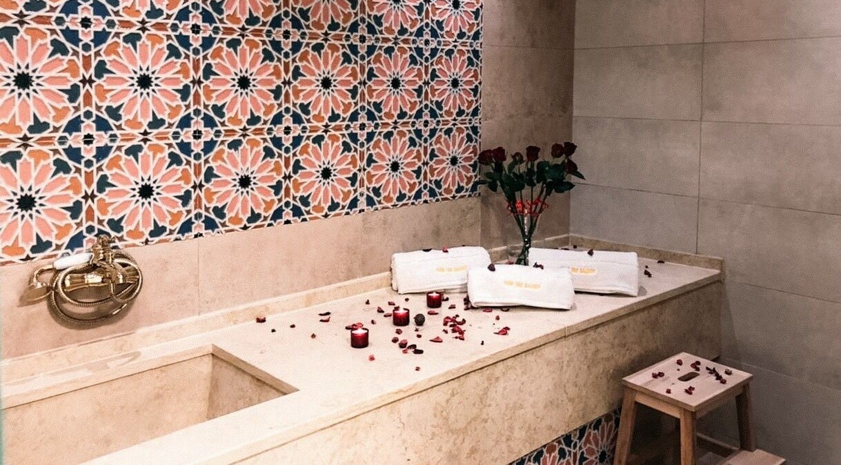 Luxurious bath setup at New Tec Saloon, Dubai, Dubai, AE featuring elegant tiles and pampering amenities.