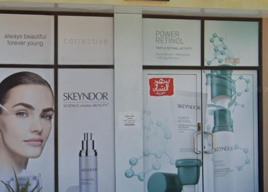 Entrance of New Tec Saloon in Dubai, Dubai, AE, featuring sleek cosmetic displays and chic design.